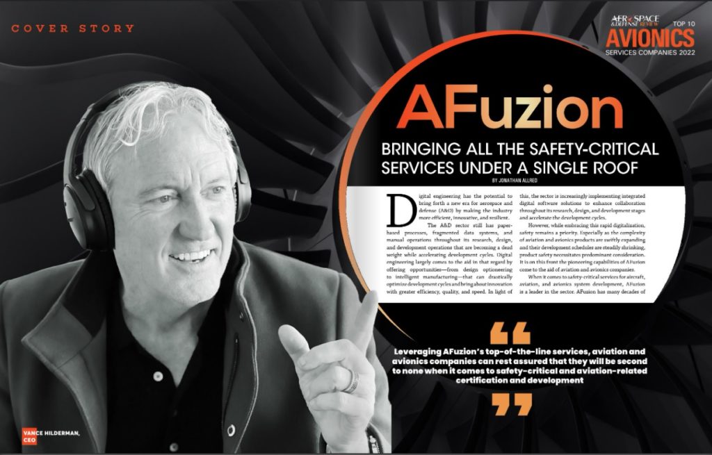 A smiling professional with headphones featured on a news magazine cover story about "Afuzion" and safety-critical services integration. | Afuzion