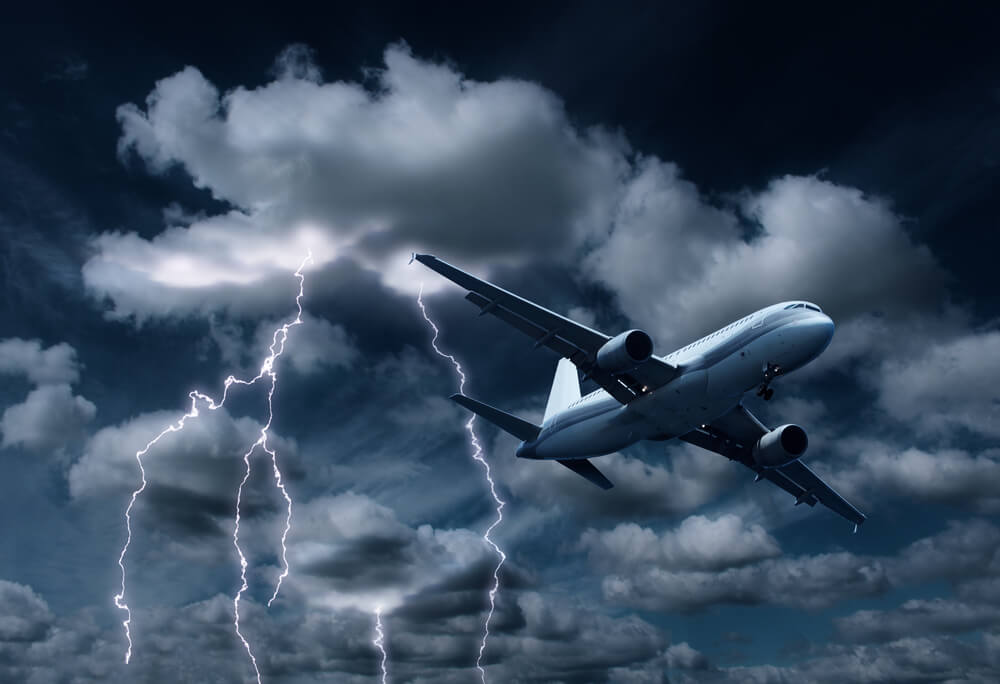 A news report highlights an airplane flying through a stormy sky with visible lightning strikes. | Afuzion